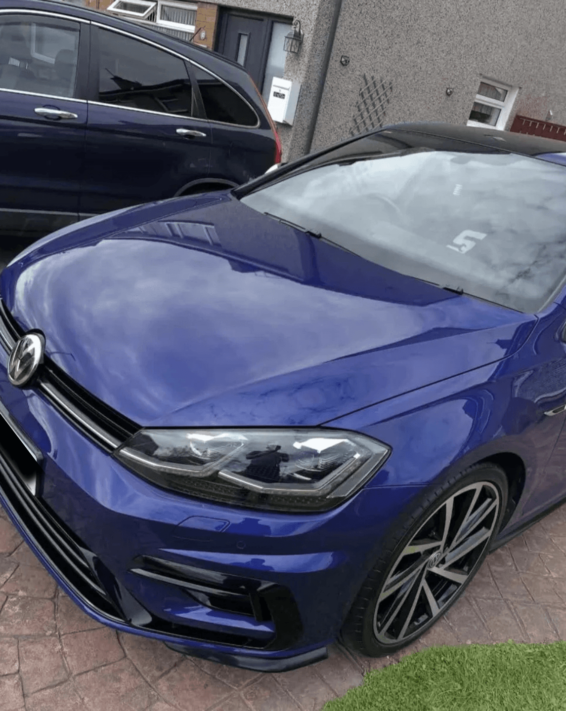 Blue Volkswagen Golf R with glossy paint after a valet