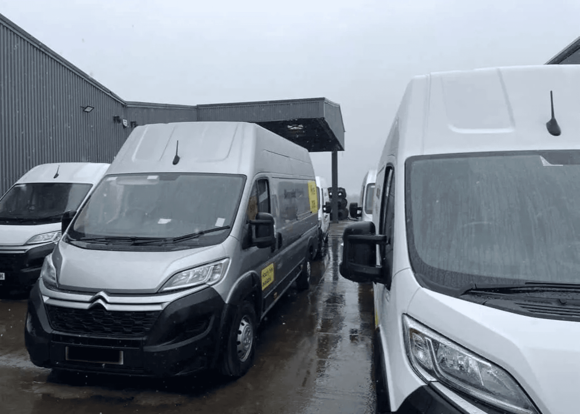 Citroen Relay and Peugeot Boxer vans lined up for a fleet wash